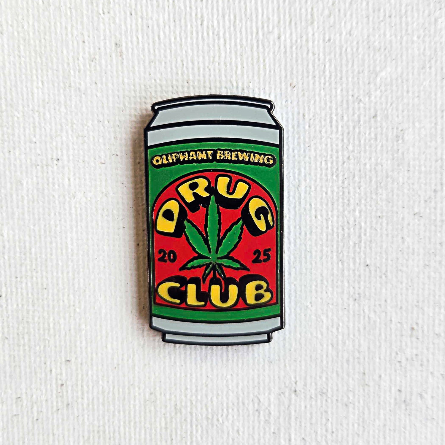 Drug Club Pin on a Cloth Background